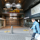 A man walks past the closed entrance to the galerie "toison d'or" following the terror alert level being elevated to 4/4, in Brussels, Belgium, 23 November 2015.